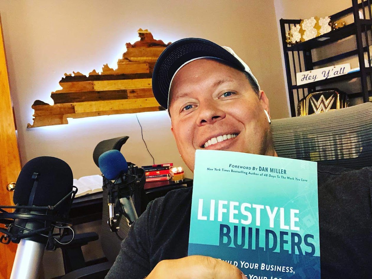 A reader holding a copy of Lifestyle Builders