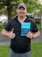 A reader holding a copy of Lifestyle Builders
