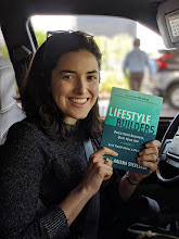 A reader holding a copy of Lifestyle Builders