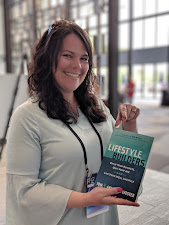A reader holding a copy of Lifestyle Builders